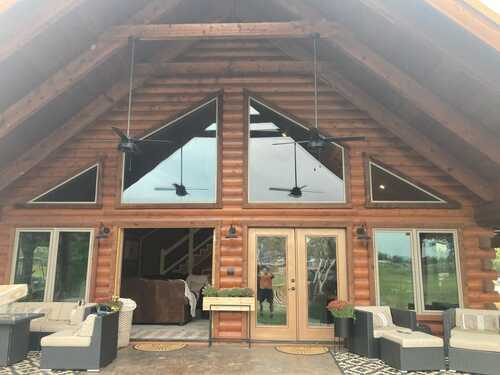 Custom vinyl windows installed in a North Texas log cabin